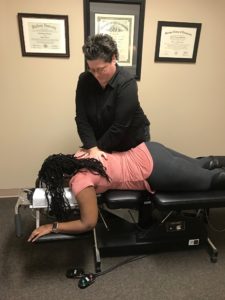 Chiropractor Leslie Sizemore Adjusting Patient